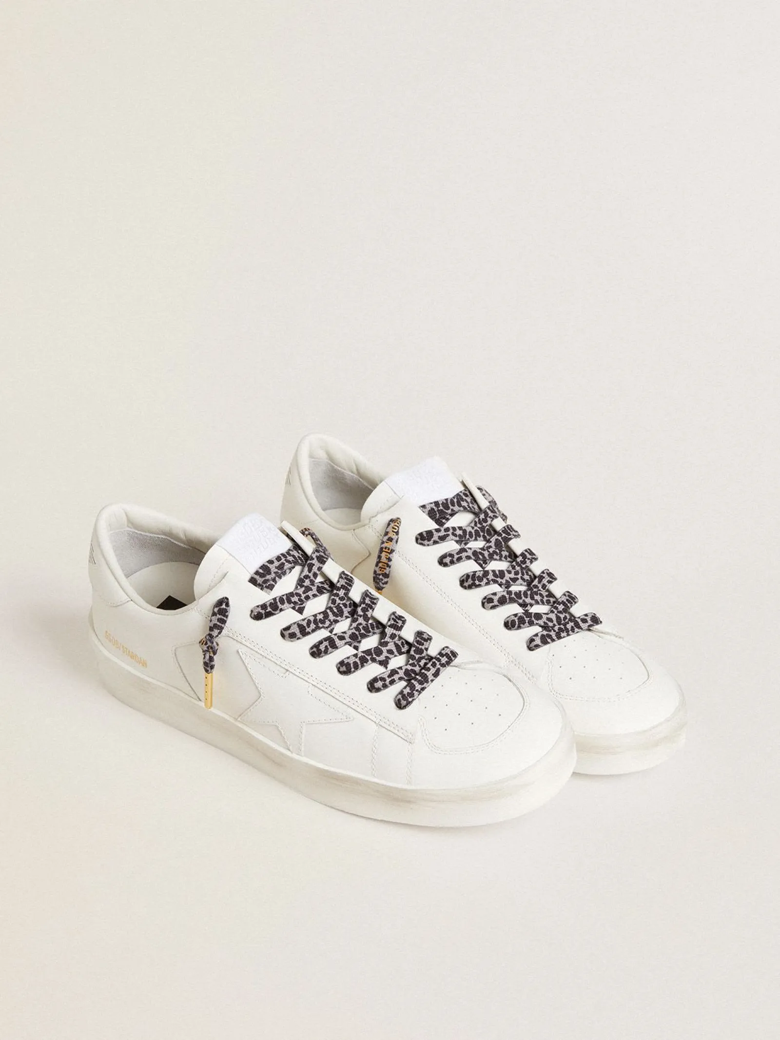 Store Golden Goose Cadarços salpicados em branco e preto com logo dourado em contraste Cor: branco e preto