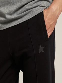 Shop Golden Goose Calça de jogging masculina preta com estrela na frente Star Collection