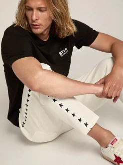 Store Golden Goose Camiseta masculina preta com logo e estrela brancos em contraste Cor: preto
