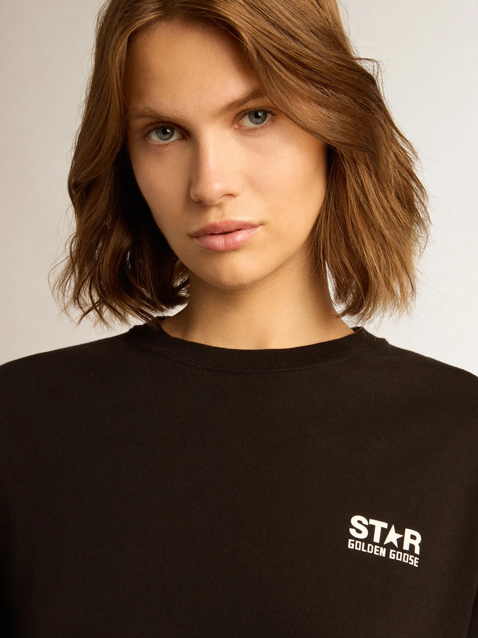 Store Golden Goose Camiseta preta Coleção Star com logo e estrela brancos em contraste Cor: preto