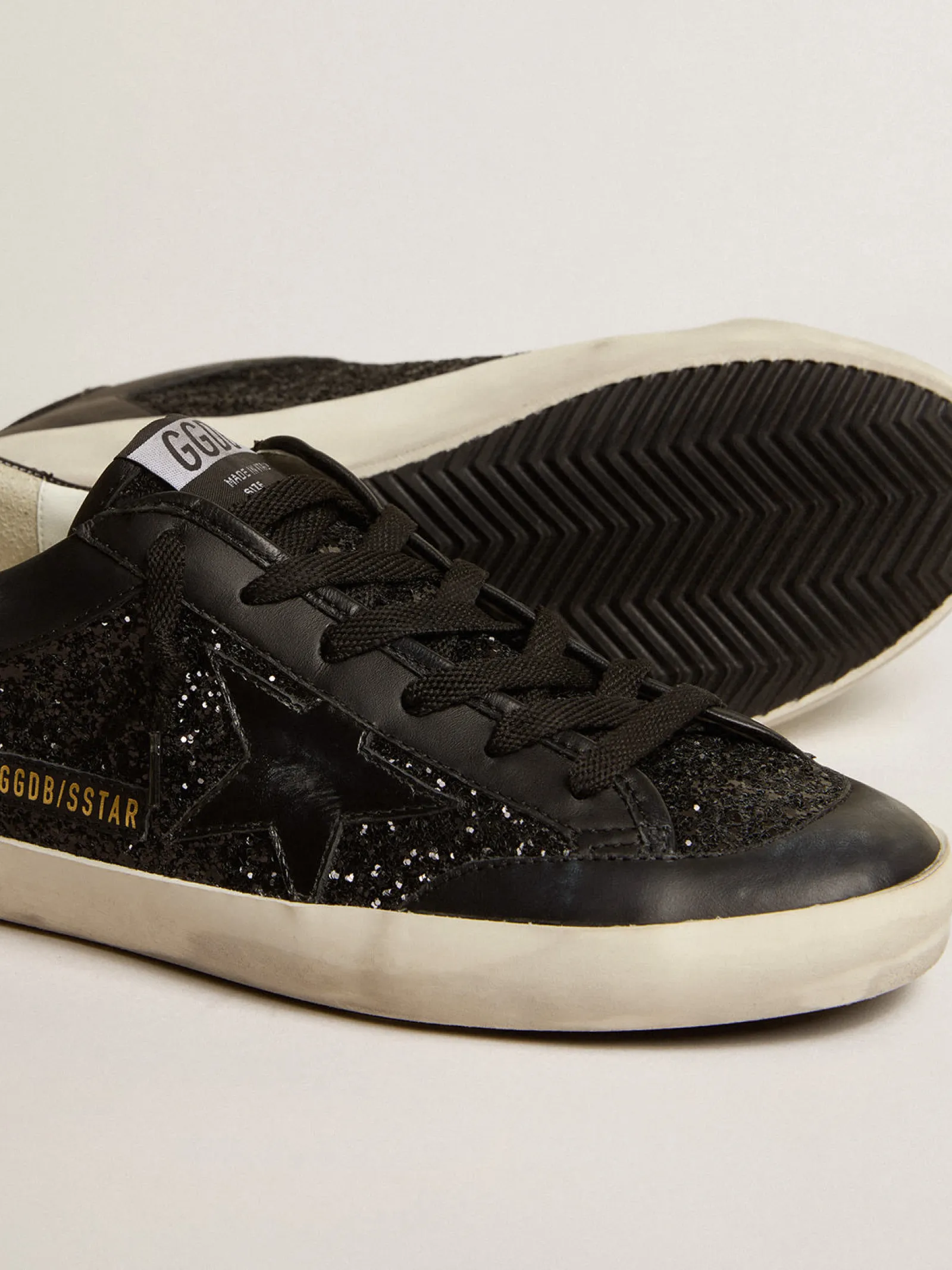 Store Golden Goose Super-Star de napa e glitter pretos com estrela de couro preto brilhante Cabedal de napa e glitter pretos